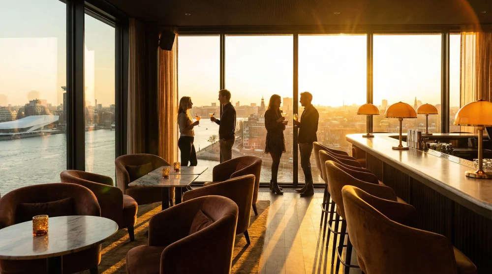 Interior view of Madam Skybar with guests enjoying cocktails during a beautiful sunset
