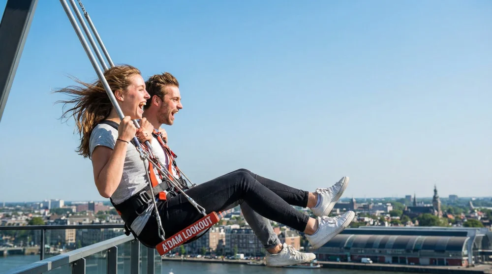 Thrill-seekers laughing while riding the swing on top of A'DAM Tower