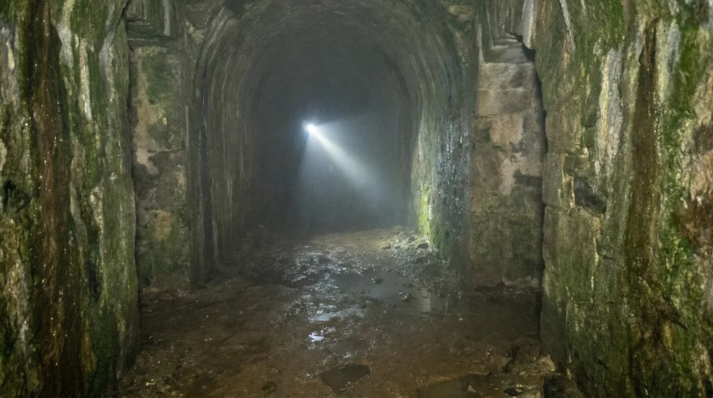 Dark, damp underground labyrinth of the Minengänge beneath Rheinfels Castle.