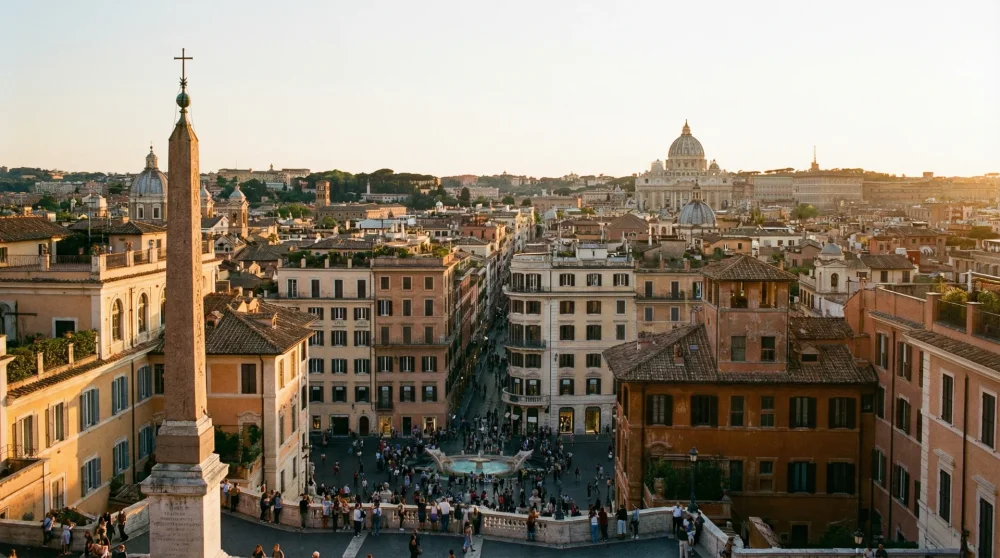 Panoramic view over the terracotta rooftops of Rome and Piazza di Spagna from the top of the Spanish Steps