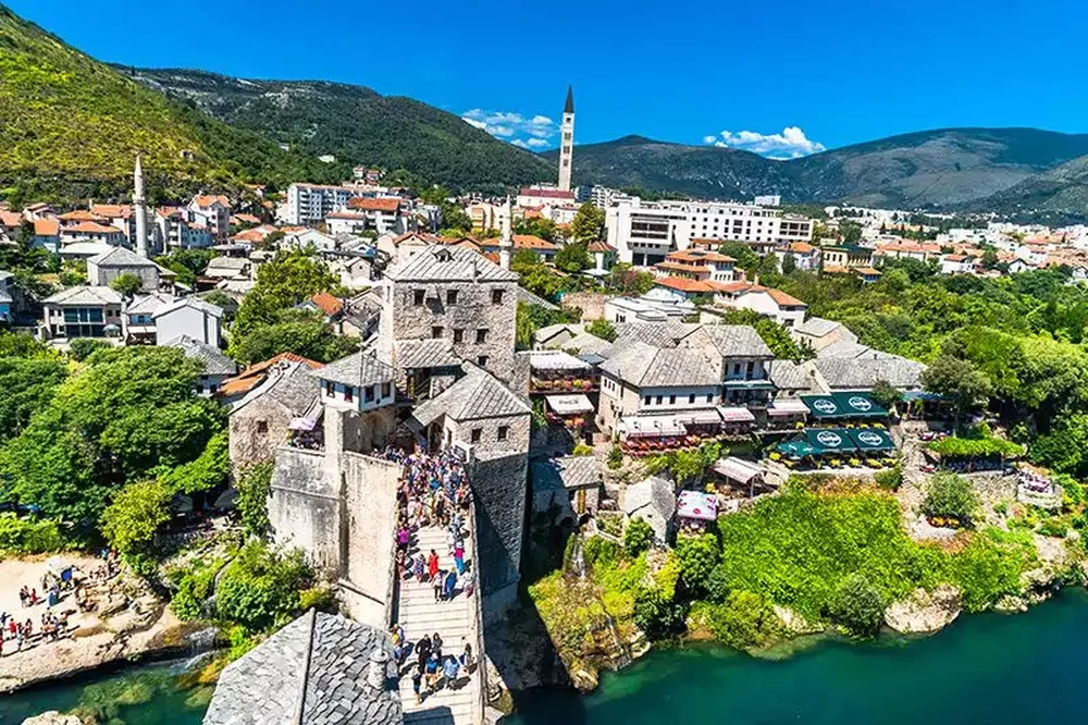 Aerial view of Mostar old town showing Stari Most bridge spanning the Neretva River with Ottoman architecture