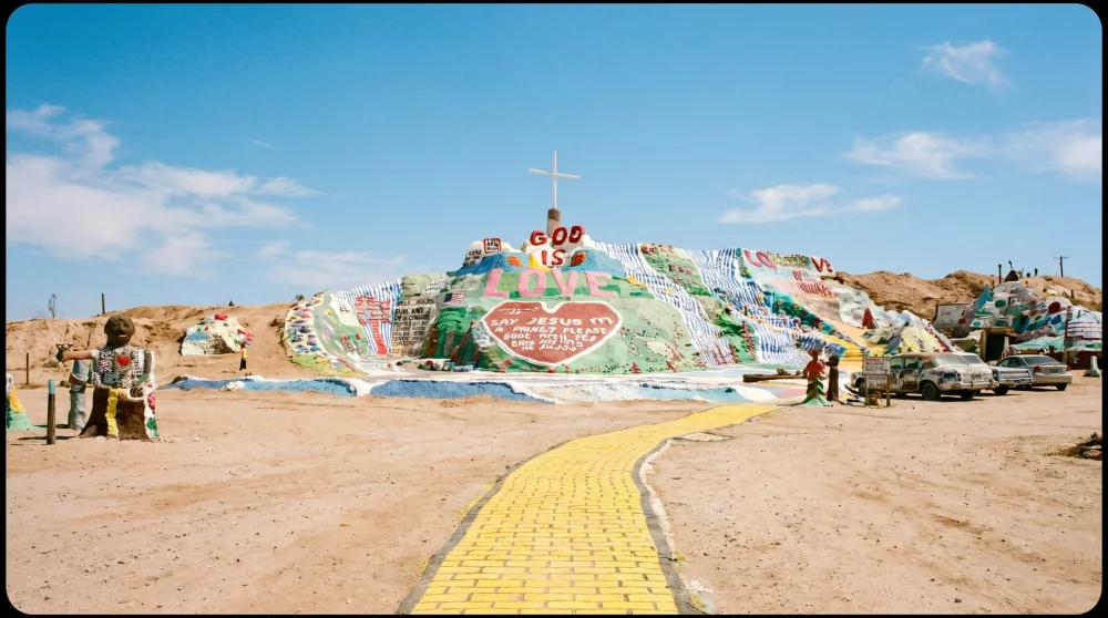 Colorful painted adobe hill known as Salvation Mountain with religious messages in Slab City desert