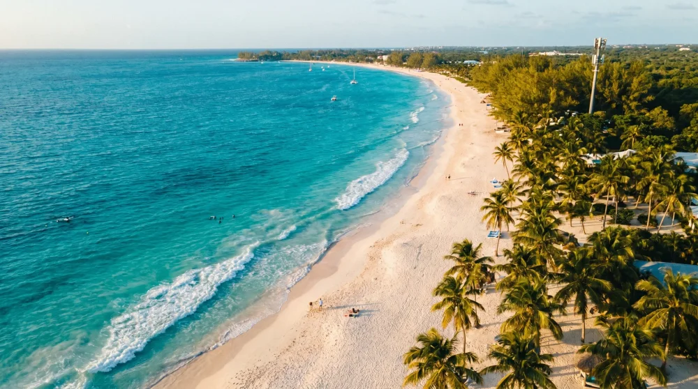 Aerial panoramic view of Seven Mile Beach in Grand Cayman representing island-wide mobile network coverage