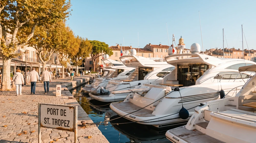 Monaco harbor in autumn after the Yacht Show crowds have departed, with warm calm weather and clearer waterfront access
