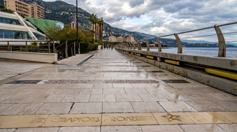 Champions Promenade Monaco waterfront with name plate and golden star embedded in wet marble floor