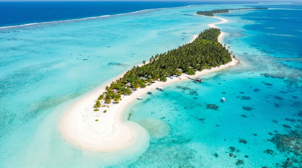 Long thin island with a white sandbank tail in South Ari Atoll, Maldives