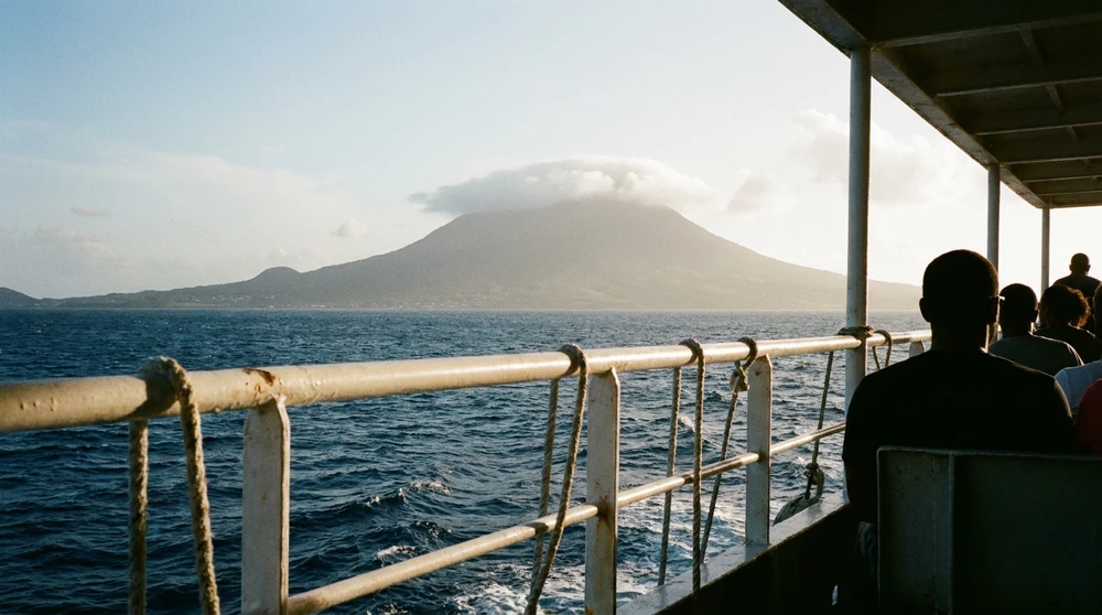 Passenger ferry crossing The Narrows toward Nevis Peak silhouette