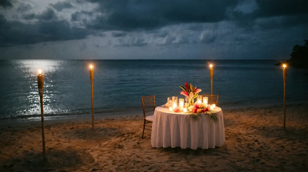 A candlelit private dinner setup for two on a deserted beach in Jamaica