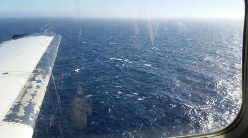 Pacific Ocean viewed from aircraft window during the 4-5 hour Nauru Airlines flight from Brisbane