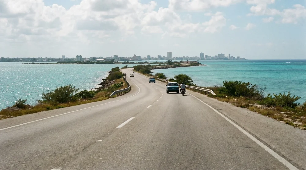 Narrow sand spit road leading to Port Royal Jamaica with Caribbean sea visible on both sides