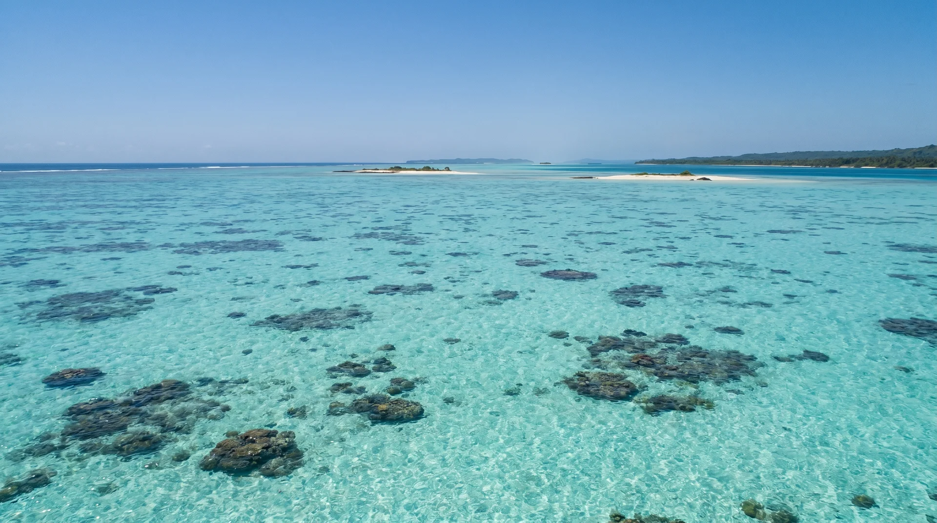 The vast turquoise lagoon at Nukufetau atoll in Tuvalu, historically used as an Allied naval base during World War II
