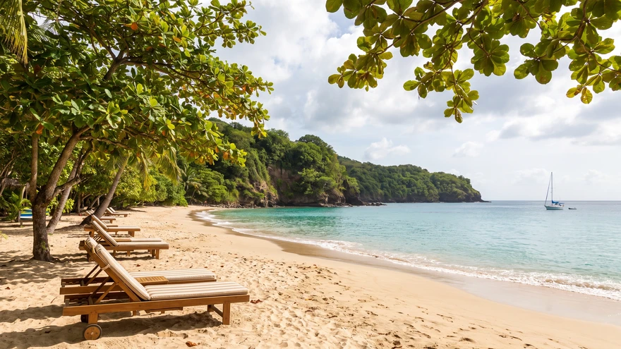 Princess Margaret Beach in Bequia with golden sand, calm turquoise water, and almond trees