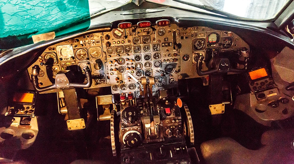 The crowded analogue cockpit of a BAC 1-11 airliner at the Malta Aviation Museum, full of dials and levers