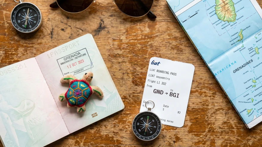 Passport with Grenada entry stamp and travel documents