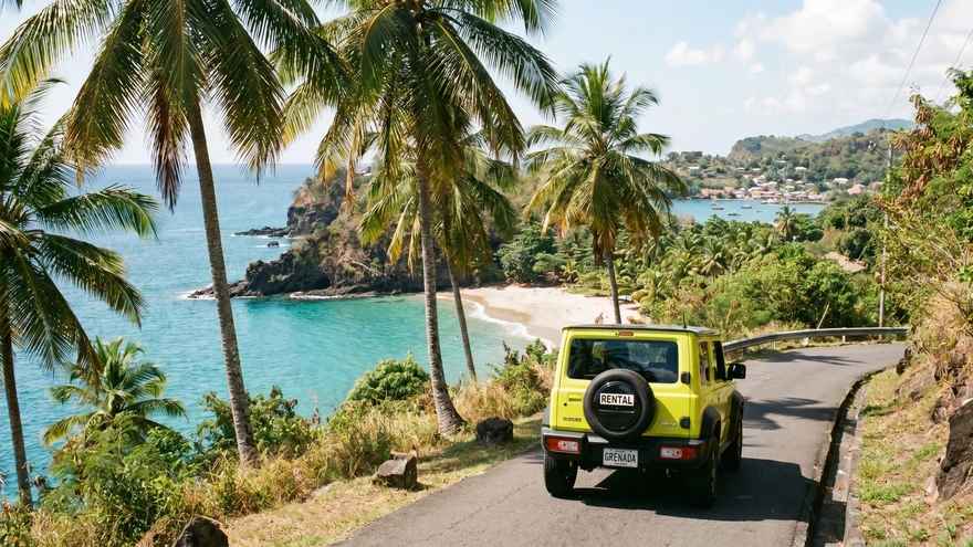 Car driving on coastal road in Grenada