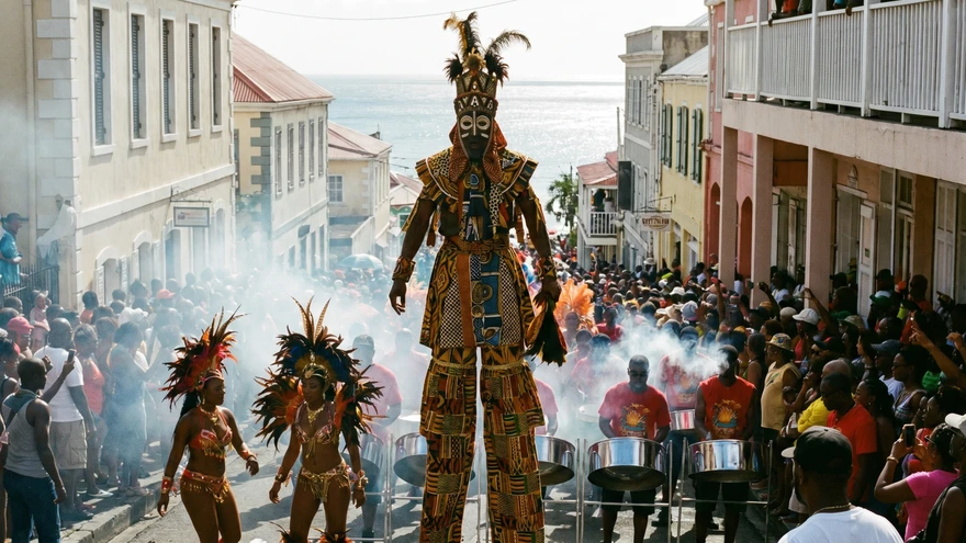 Moko Jumbie stiltwalker towers above the crowd during the Spicemas Parade of