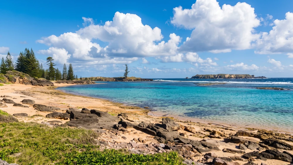 Rocky shoreline and turquoise reef flats at Slaughter Bay, Norfolk Island