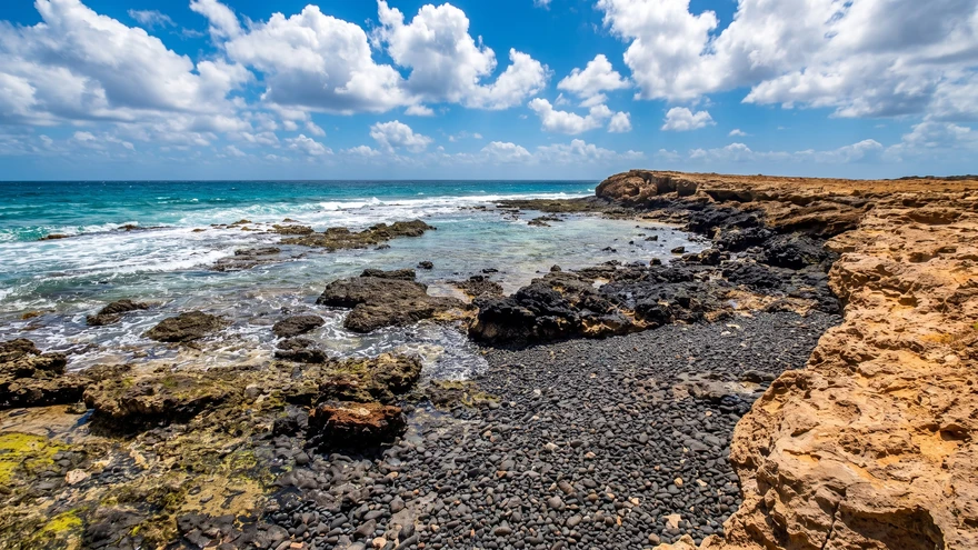 Clear tidal rock pool inside a volcanic cave near Curral Velho, Boa Vista