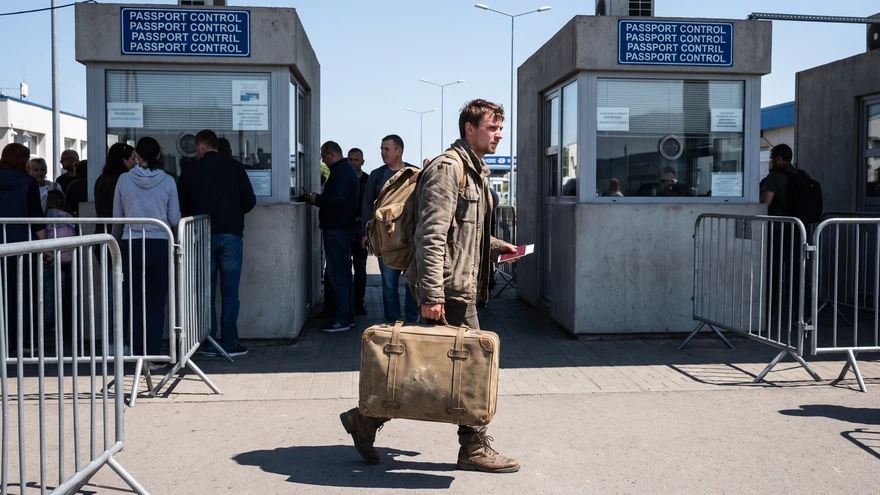 Traveler walking across the pedestrian border checkpoint between Spain and Gibraltar
