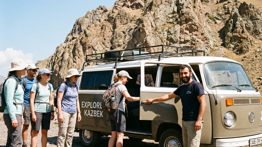 Tourists boarding a private minibus tour at the base of the Rock