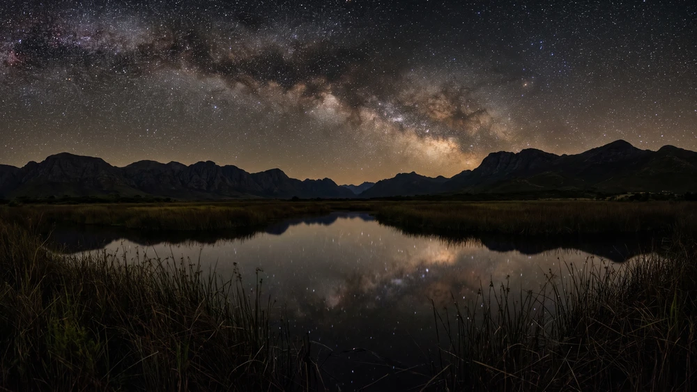 Milky Way visible over the Kogelberg wetlands near Palmiet Lagoon at night