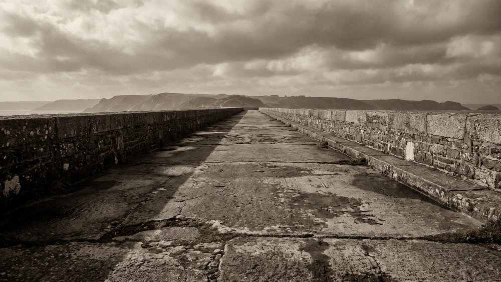 The weathered concrete surface of La Coupee causeway