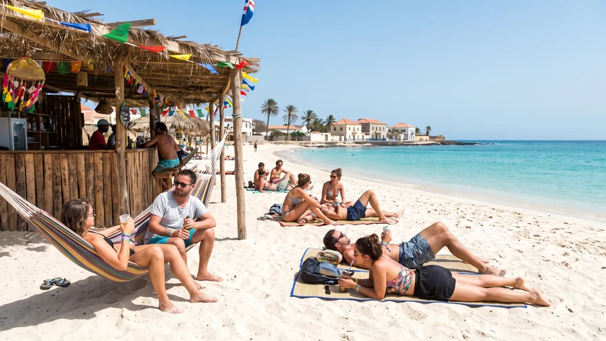 White sand beach and beach bar in Mindelo where visitors relax after Carnival
