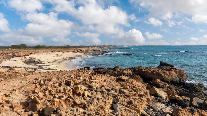Volcanic black sand beach and rocky shoreline at Praia Preta near Cabocan, Sal