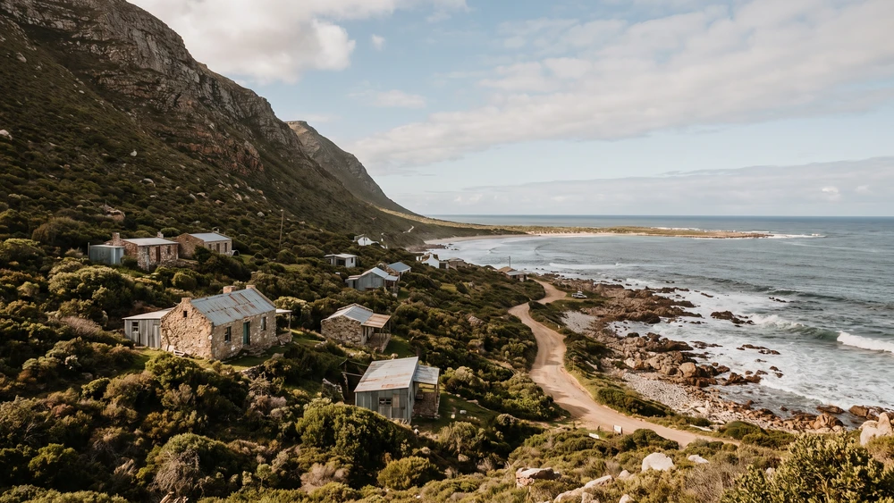 Rooiels village nestled below Klein Hangklip mountain along the fynbos-covered Western Cape coastline