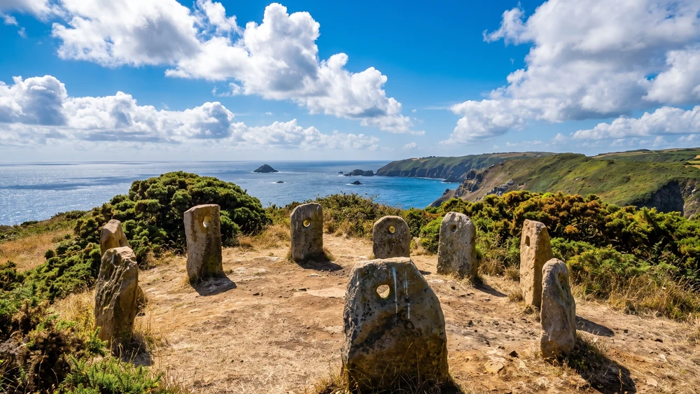 The nine granite standing stones of Sark Henge on the southern cliff path