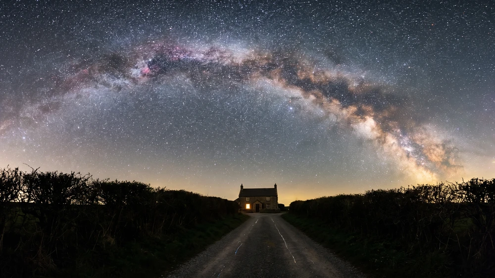 The Milky Way visible above a dark lane on Sark, the world's first Dark Sky Island