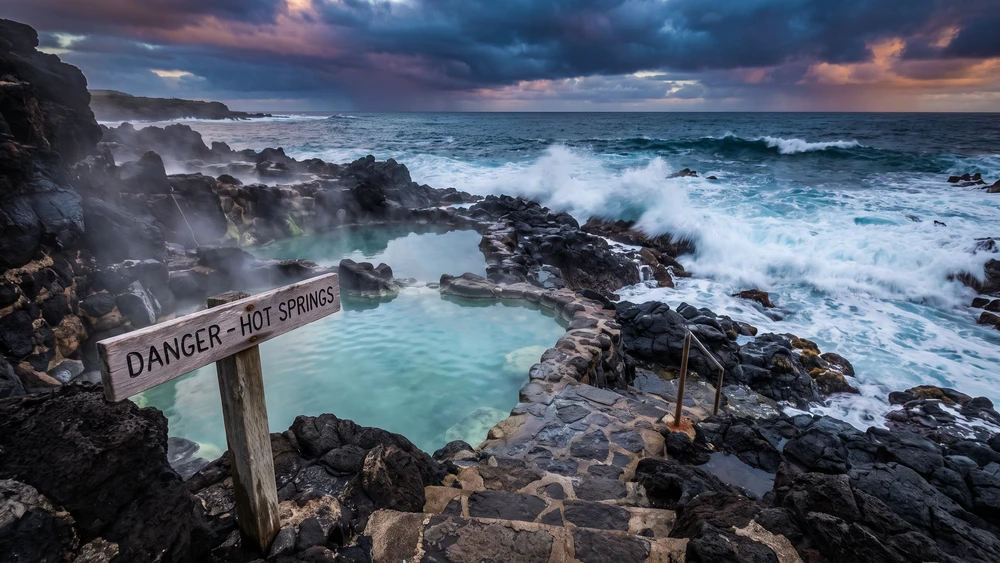 Yudomari Onsen's open-air hot spring pools built into the rocky coastline of Kodakarajima
